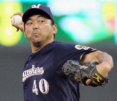 Brewers' Saito gets 1st win of season