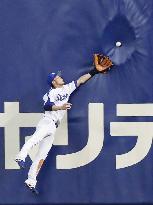 Batted ball hits fence during baseball game at Nagoya Dome