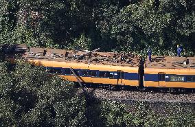 Train hits leaning utility pole in central Japan