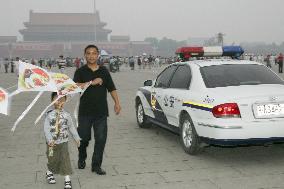 Police keep watch at Tiananmen Square on 17th anniversary