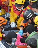 Girl rescued from collapsed apartment complex in Taiwan