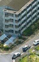 Man locks himself in building in Tokyo suburb, fires outside