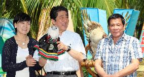 Japan PM Abe in Philippine president's hometown