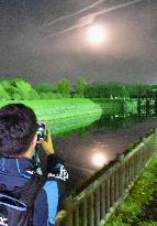 Supermoon lights up sky in Japan