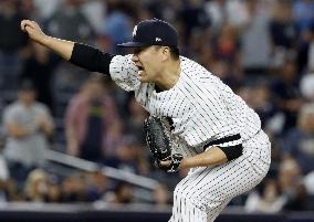 Tanaka keeps Yankees alive in ALDS