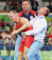 Olympic scenes: Joyous wrestling medalist coach