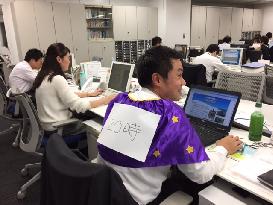 Japan to embark on work-hour reform after young worker's death