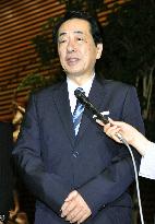 Kan speaks to reporters