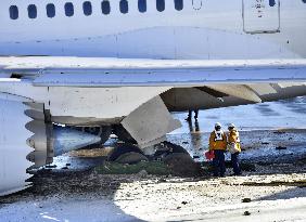 JAL plane running off taxiway at Narita