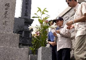 Iraqi boy visits graves of Japanese journalists who helped him