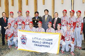 Abe with young baseball players