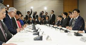 Japan retains economic assessment in Feb., cuts global view
