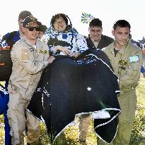 Astronauts return to Earth