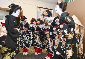 Maiko in Kyoto mark first business day of year