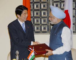 Abe, Singh adopt road map for ties, differ on climate, nukes