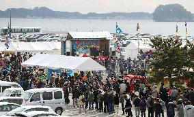 Oyster festival in quake-hit town