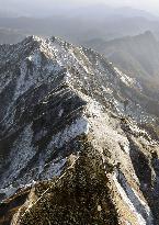 Mt. Daisen covered with season's 1st snow