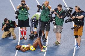 Olympic scenes: Photographers target gold medalist
