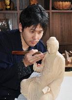 Carver of Buddha images takes to YouTube to explain art to the world