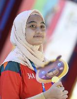 Asian Games: woman with fan