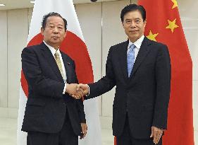 LDP Toshihiro Nikai and Chinese Commerce Minister Zhong Shan