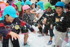 Okinawa children play in snow