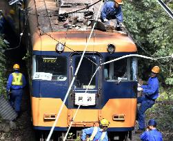 Train hits leaning utility pole in central Japan