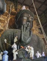 Annual cleaning of Great Buddha of Nara