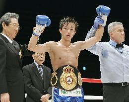Boxing: Japan's Taguchi defends WBA light flyweight title
