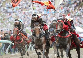 Armored warriors compete in horse race
