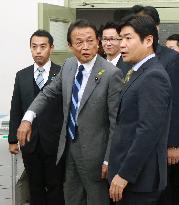 Finance Minister Aso peps up employees working on budget