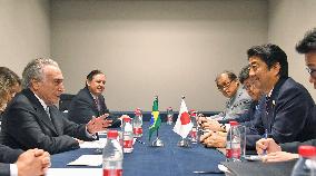 Japanese PM Abe, Brazil's new president hold 1st talks