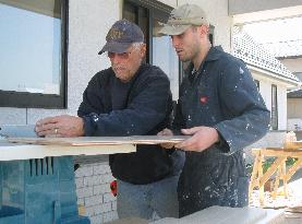 U.S. volunteers repair tsunami-hit buildings