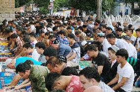 Ethnic Uyghurs following Ramadan in Urumqi