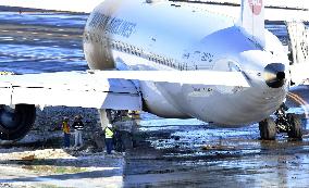 JAL plane running off taxiway at Narita