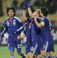 Japan overpower Denmark to cruise into last 16