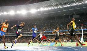 Olympics: Bolt completes 3rd sprint double with 200 win