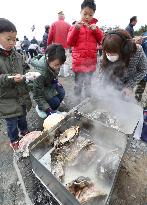 Oyster festival in quake-hit town