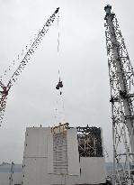 Removal of panels covering Fukushima reactor building starts