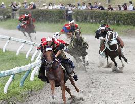 Armored warriors compete in horse race