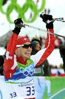 Cologna claims gold in men's cross-country 15km freestyle