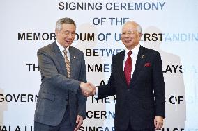 Malaysia, Singapore sign on bullet-train project agreement