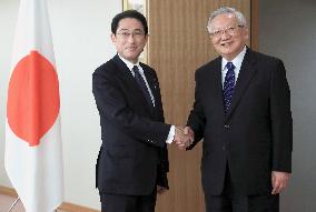 Japan foreign minister, ex-China diplomat agree to promote ties
