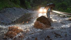 River flooding reported as heavy rain hits southwestern Japan