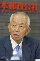 Japan Post profit dives 51% on halving of savings division's gai