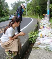 People pray for soul of slain Okinawan woman