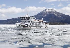 Sightseeing boat Mashu Maru breaks ice on Lake Akan