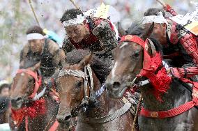 Armored warriors compete in horse race