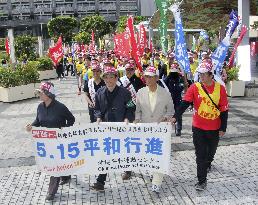Protesters march in Okinawa ahead of 46th reversion anniversary