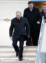 Putin arrives in Japan for summit with Abe